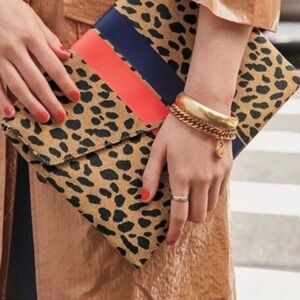 Stella & Dot Clutch Purse Bellamy Animal Dot Leopard Print navy & orange stripe